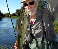 Harry holds up a wild trout