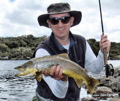 Steve holding a wild brown trout from the Western Lakes