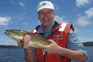 Alec with a wild trout caught at Lake Leake Tasmania