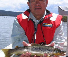 Chuck holding a wild Tasmanian trout