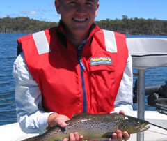 Duncan holding a wild Tasmanian trout