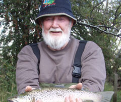 John holding a wild brown trout caught on the Tups Indispensable fly