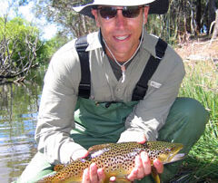 Rob holds a wild trout caught with a Red Tag fly