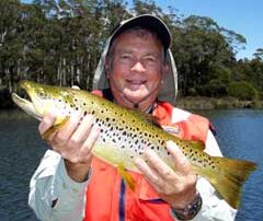 Ron holding up his wild brown trout